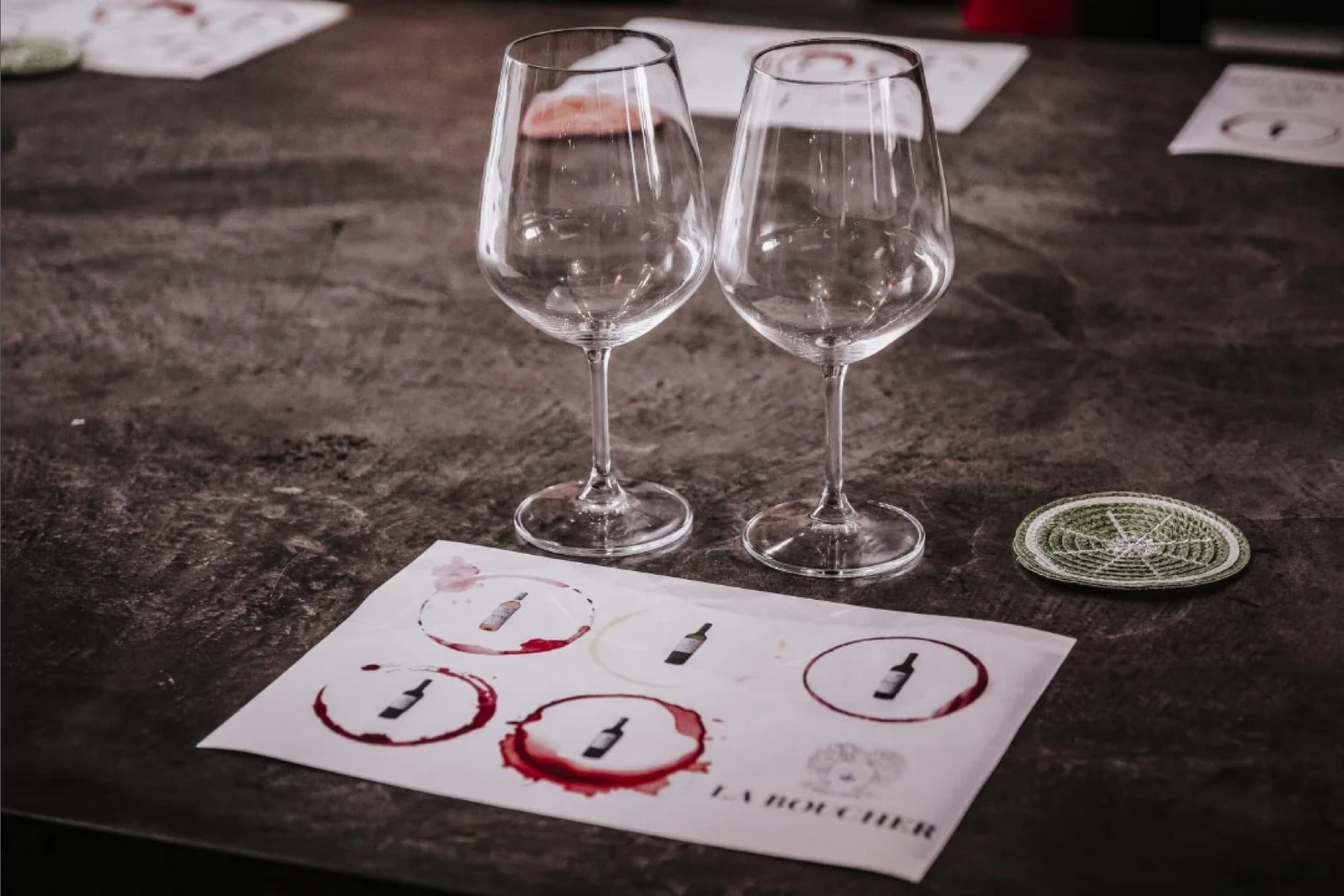 Wine glasses and tasting notes on a table